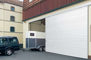 Sliding garage door for increased space inside and out